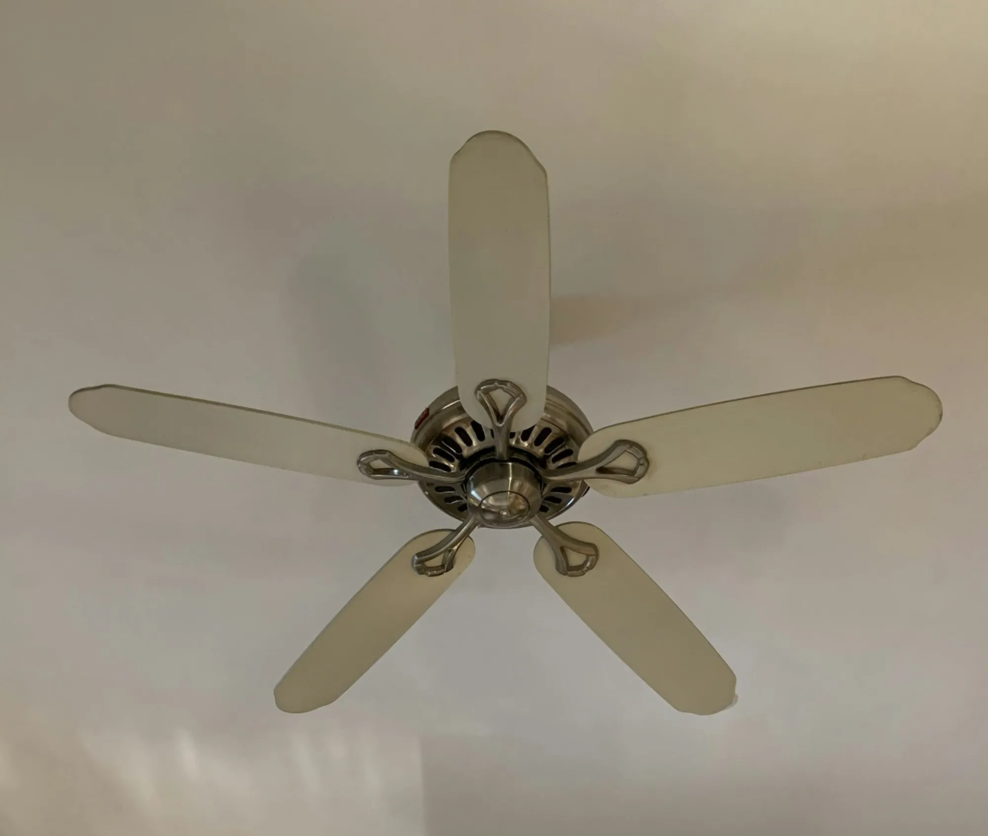 Five-blade ceiling fan mounted on a white interior ceiling