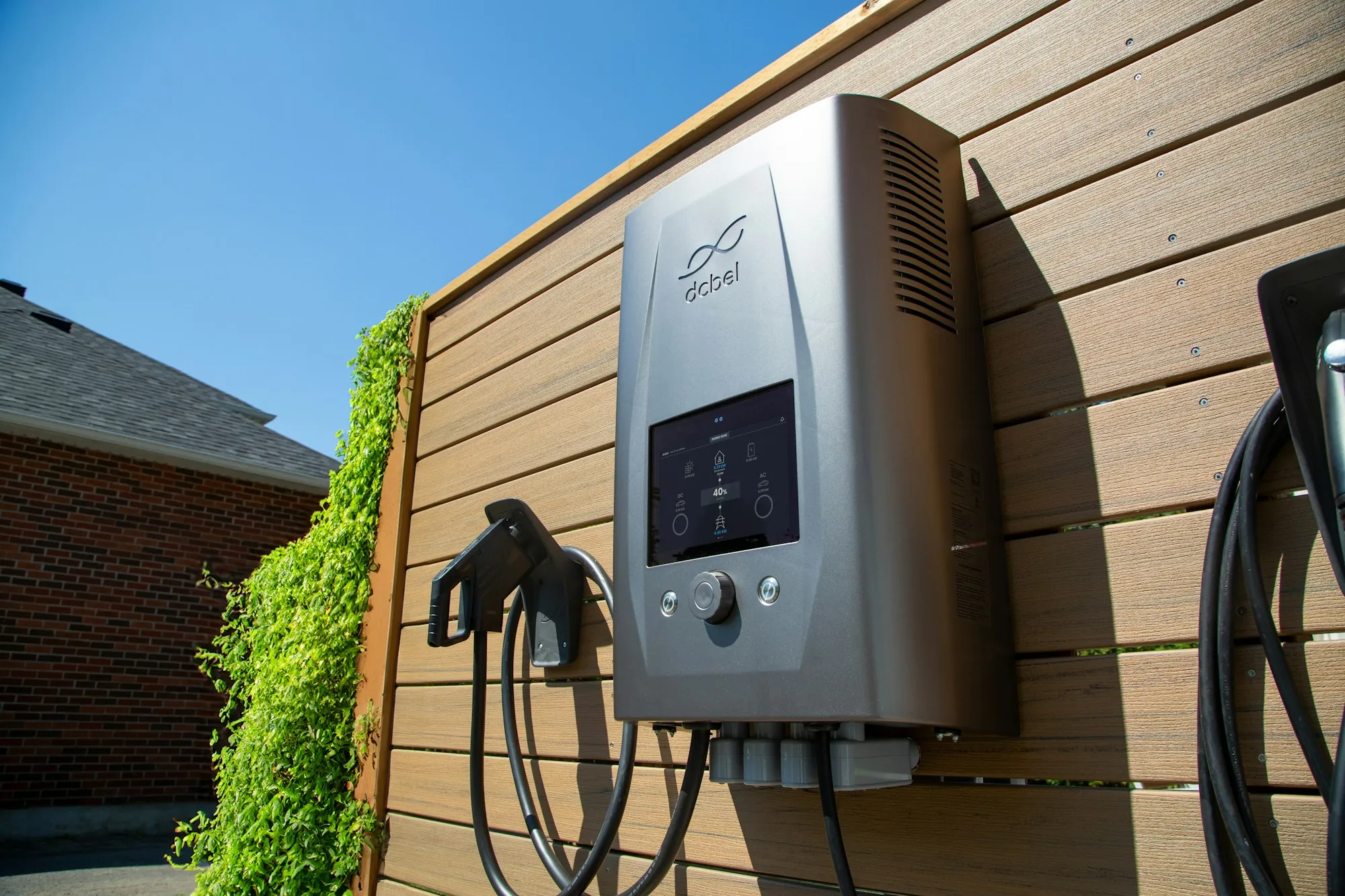 Level 2 electric vehicle charger mounted on a garage wall