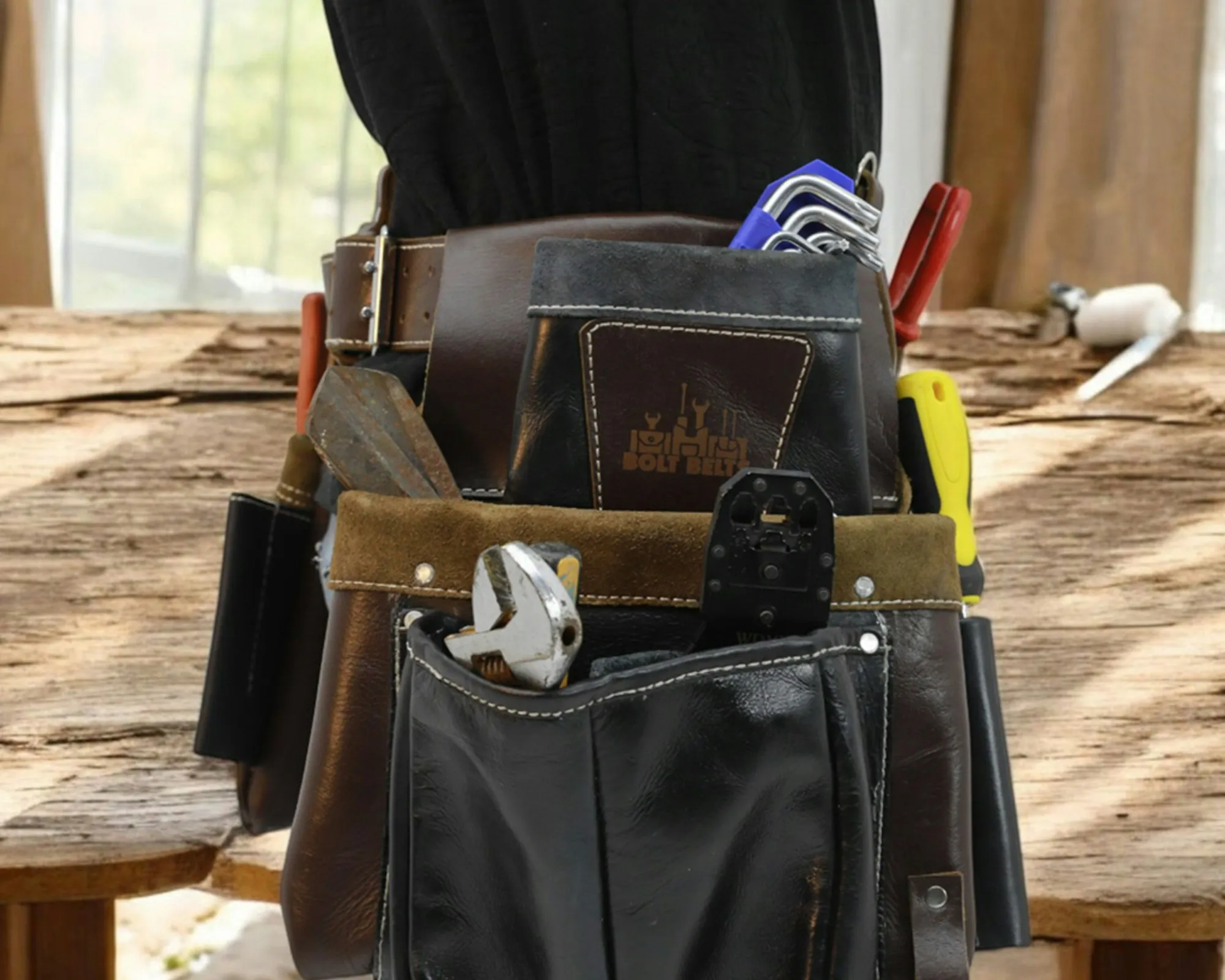 Electrician's tool belt loaded with hand tools