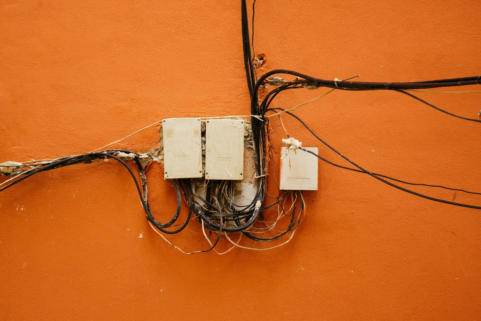 Junction boxes and conduit runs on an interior wall